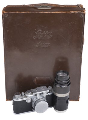 Lot 145 - Leica IIIf film camera with several lenses and accessories