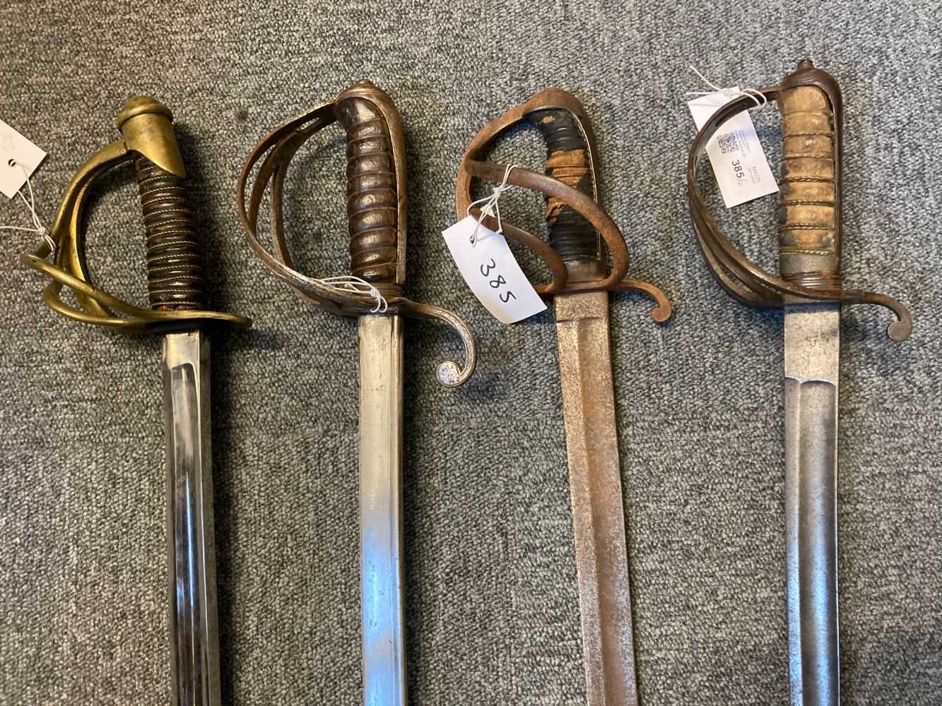 Lot 385 - Swords. A 19th century American cavalry sword and three other swords