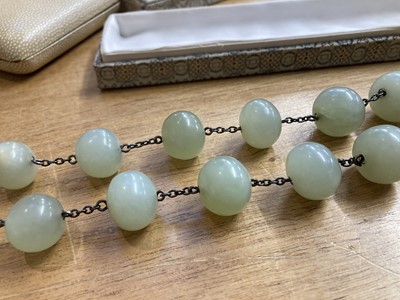 Lot 584 - Jade. A Chinese jade bead necklace, probably 1920/30s