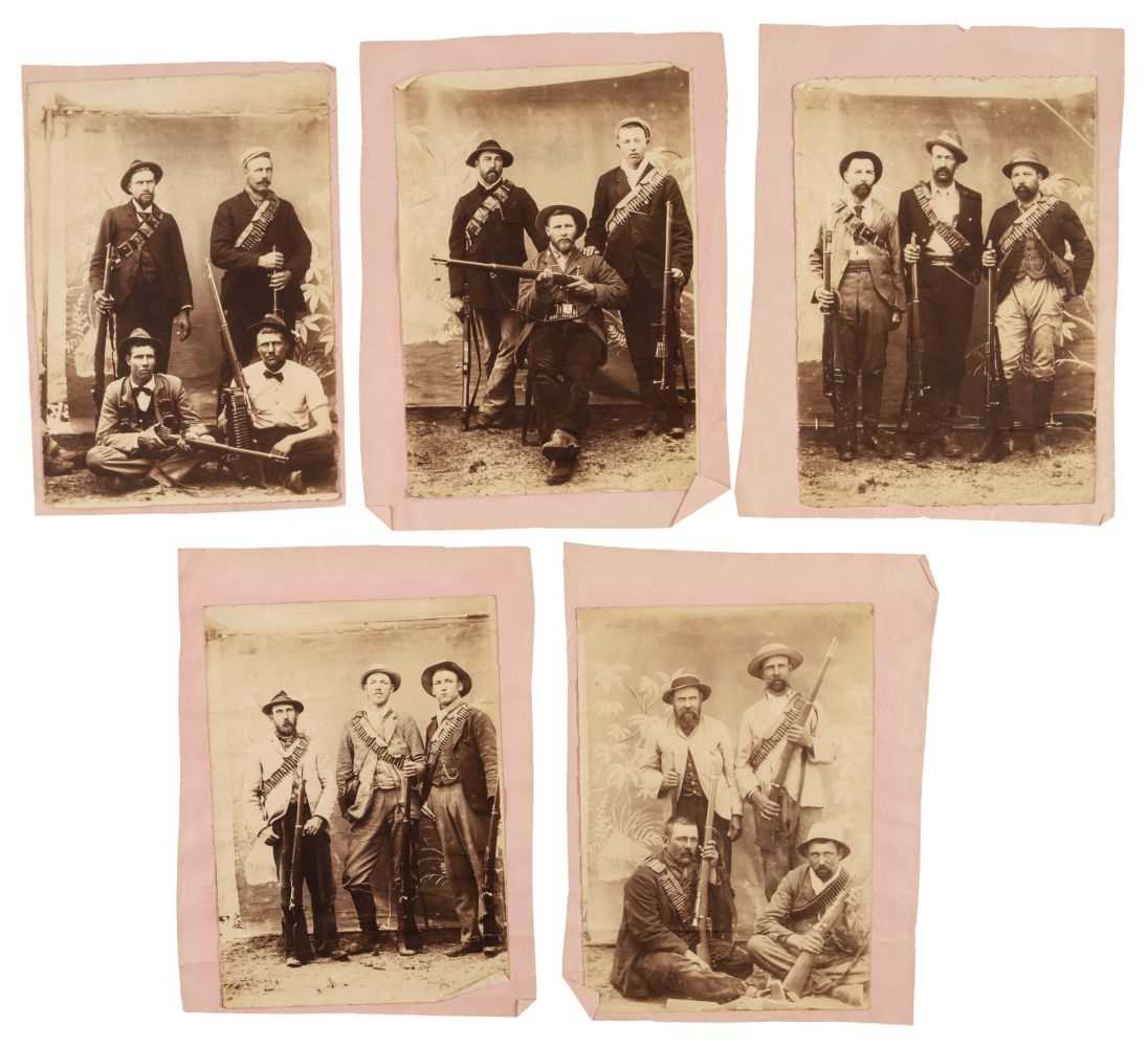 Lot 5 - Boer War. A group of 5 photographs of Boer men with rifles and bullet belts, c. 1900