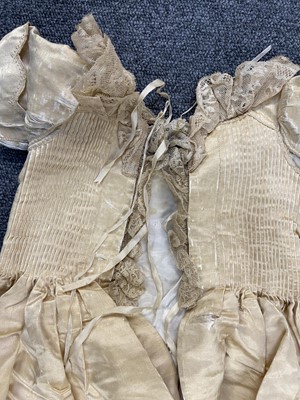 Lot 332 - Clothing. A silk christening gown, Steinmann & Co., Piccadilly, London, circa 1900