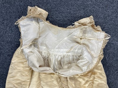 Lot 332 - Clothing. A silk christening gown, Steinmann & Co., Piccadilly, London, circa 1900