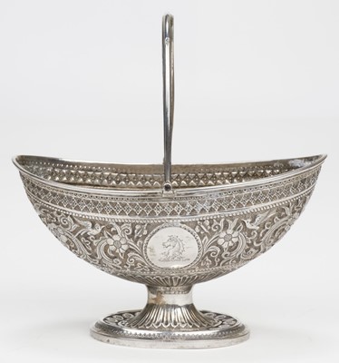 Lot 789 - Sugar Basket. A Victorian silver swing handle sugar basket, by Henry Holland (of Holland, Aldwinckle & Slater), London, 1879