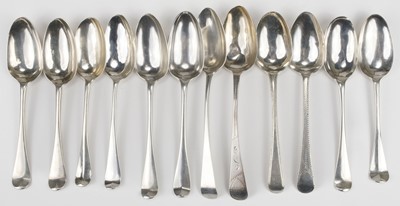 Lot 783 - Spoons. A collection of silver serving spoons, including a pair of George III serving spoons...