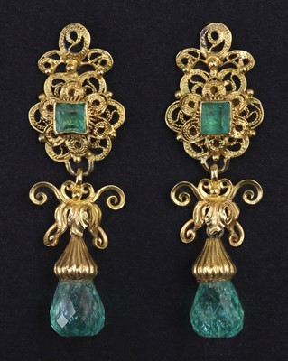 Lot 797 - Earrings. A pair of emerald and diamond yellow metal drop earrings