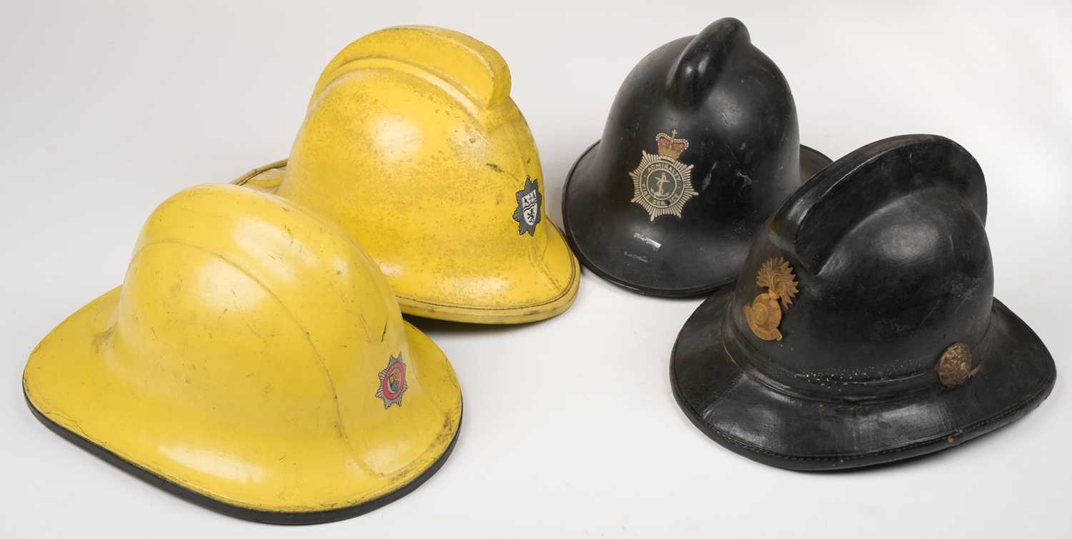 Lot 182 - Fire Fighting. A collection of British fireman's helmets