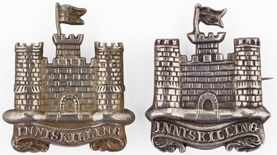 Lot 429 - Inniskilling Dragoons. Two Irish white metal arm badges