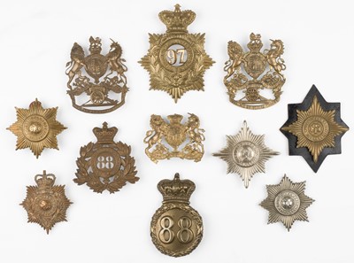 Lot 402 - Connaught Rangers. A Victorian shako plate of the 88th Foot, plus other badges