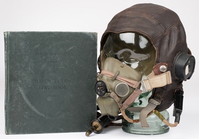 Lot 143 - Flying helmet & logbook. A WWII RAF C-Type pilot’s flying helmet circa 1940s