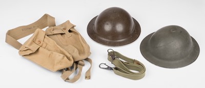 Lot 426 - Helmets & accoutrements. A WWII British Brodie steel helmet and other items