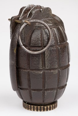 Lot 451 - Munitions. A WWI INERT No 23 mills bomb dated 1916